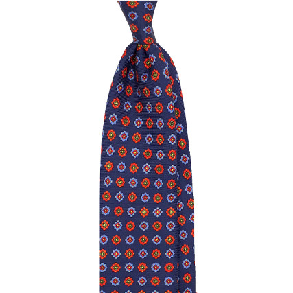 Mixed orange flowers blue tie